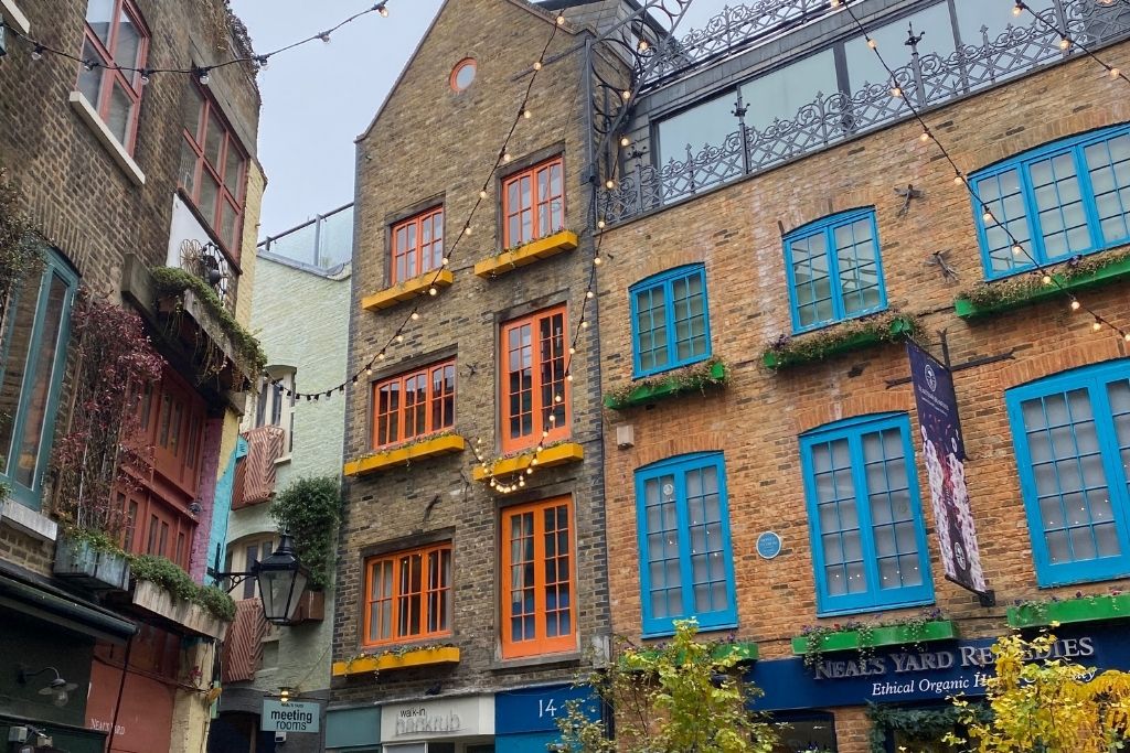 Neal's Yard in London. Colorful windows surround a courtyard.