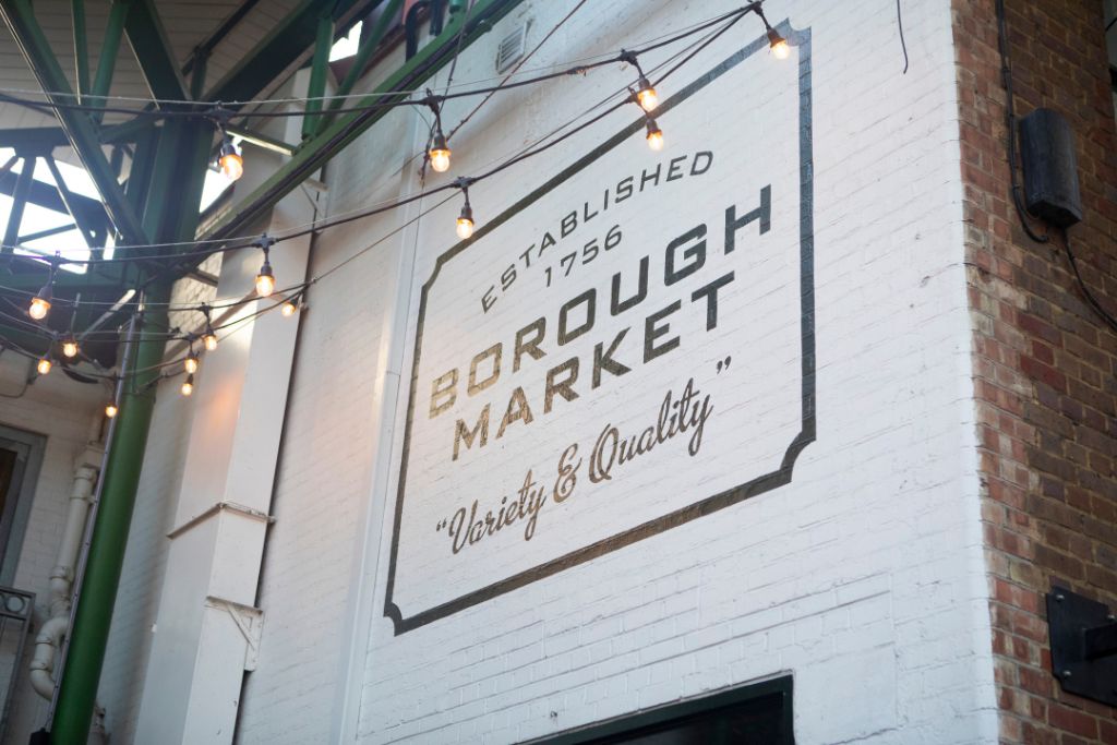 Brick wall in Borough Market with writing that says Established 1756 Borough Market Variety & Quality