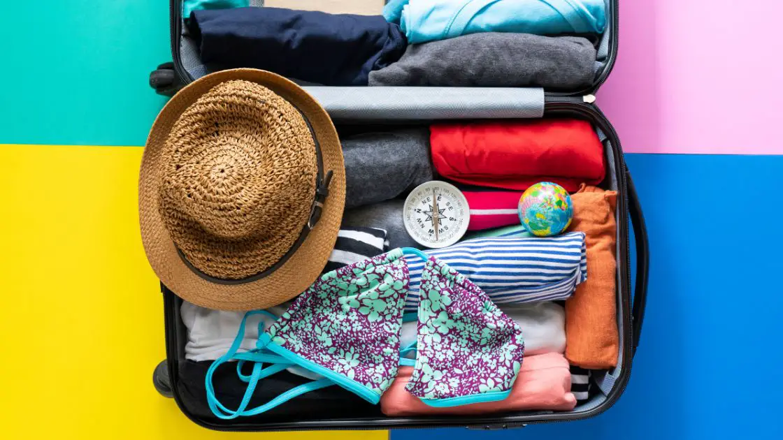 Suitcase packed for summer travel in the UK