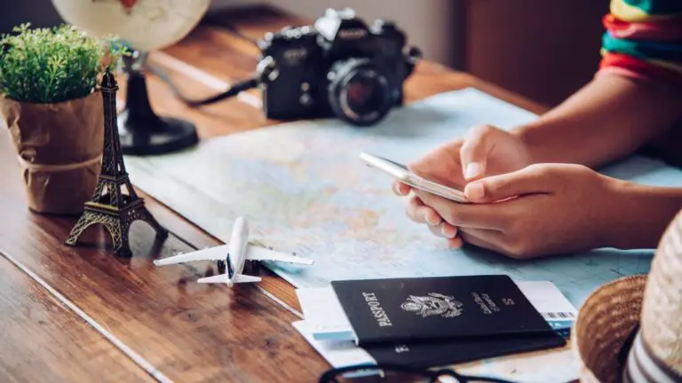 Travel apps for UK and Europe travel person using phone app with passport