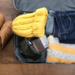 Suitcase packed for a UK winter trip