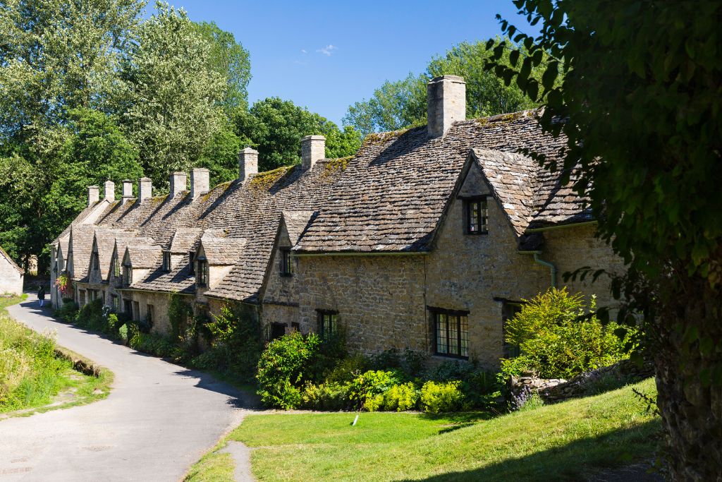 Row of stone houses in Bibury in the Cotswolds