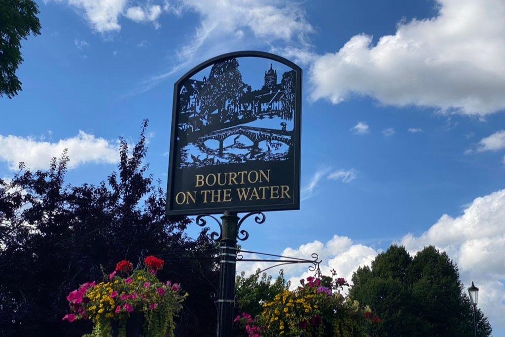 Bourton-on-the-water village sign in the Cotswolds.