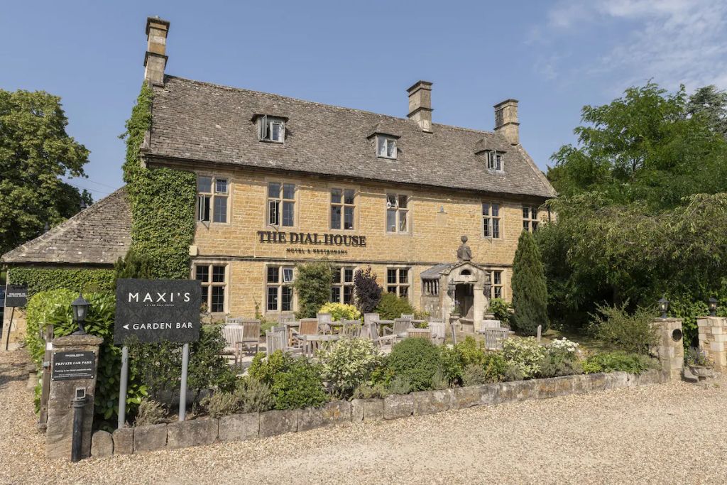 Exterior honey brick facade of The  Dial House hotel and restaurant in Bourton-on-the-Water