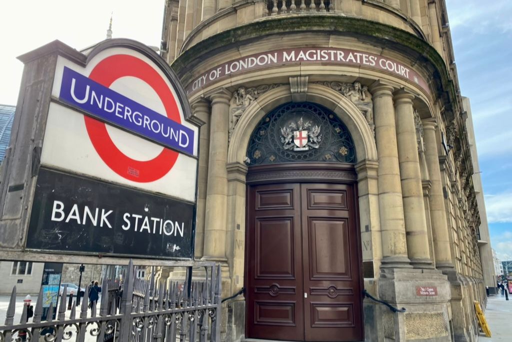 Entrance to Bank station on the London Underground network. Sign for the station appears next to the entrance for the City of London Magistrates Court.