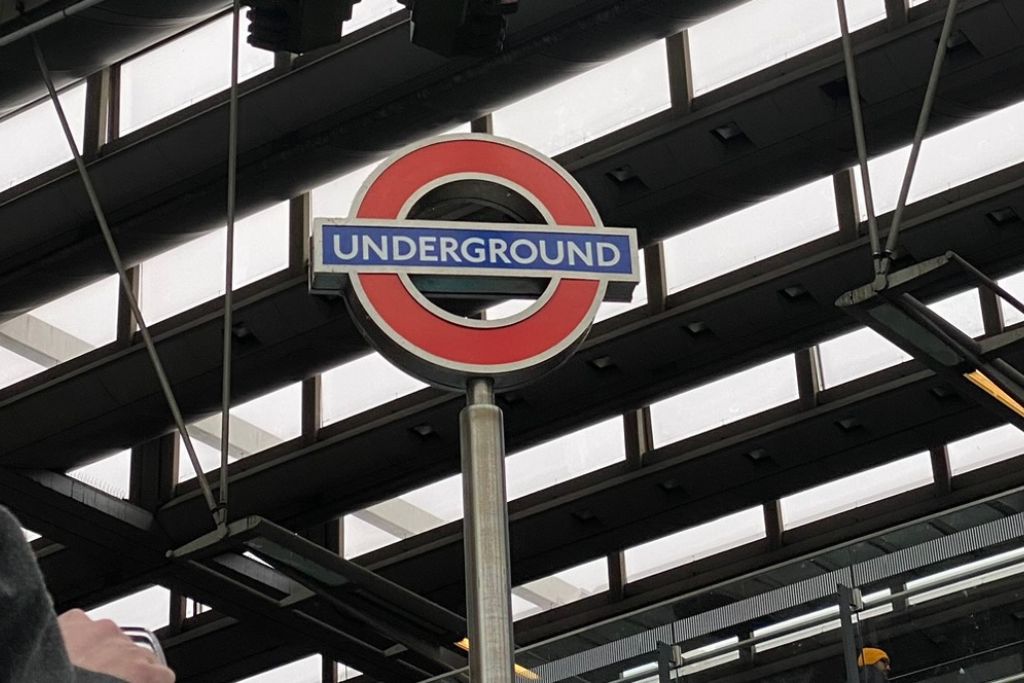Red circle sign with a blue bar reading "Underground". This sign marks an entrance to the London Underground, or Tube, train network.