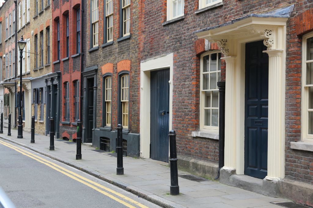 Brick terraced homes along a street in the Shoreditch neighborhood in London.