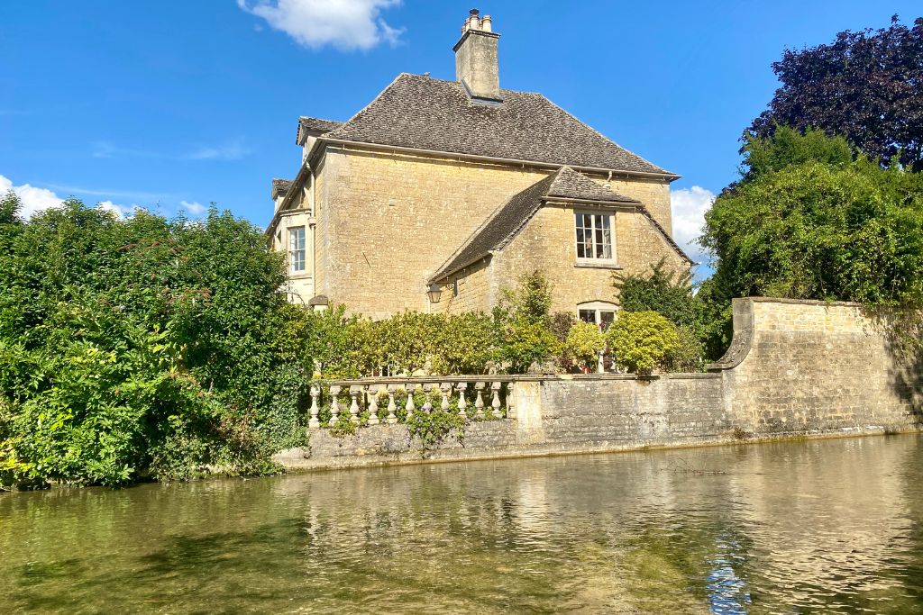 Stone cottage along a stream in Bourton-on-the-water in the Cotswolds.