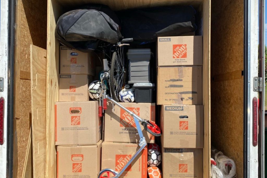 Moving boxes packed for a move from the US to the UK